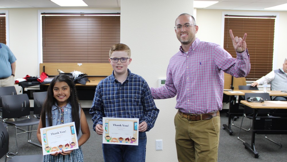 Lexi and Jenson Lead Pledge at April Board Meeting